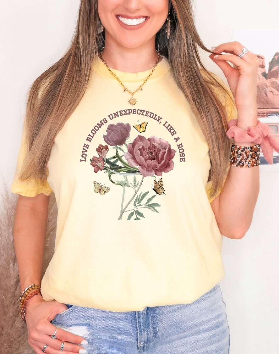 Comfy Love Blooms Unexpectedly Like A Rose T-shirt with Pink Lettering