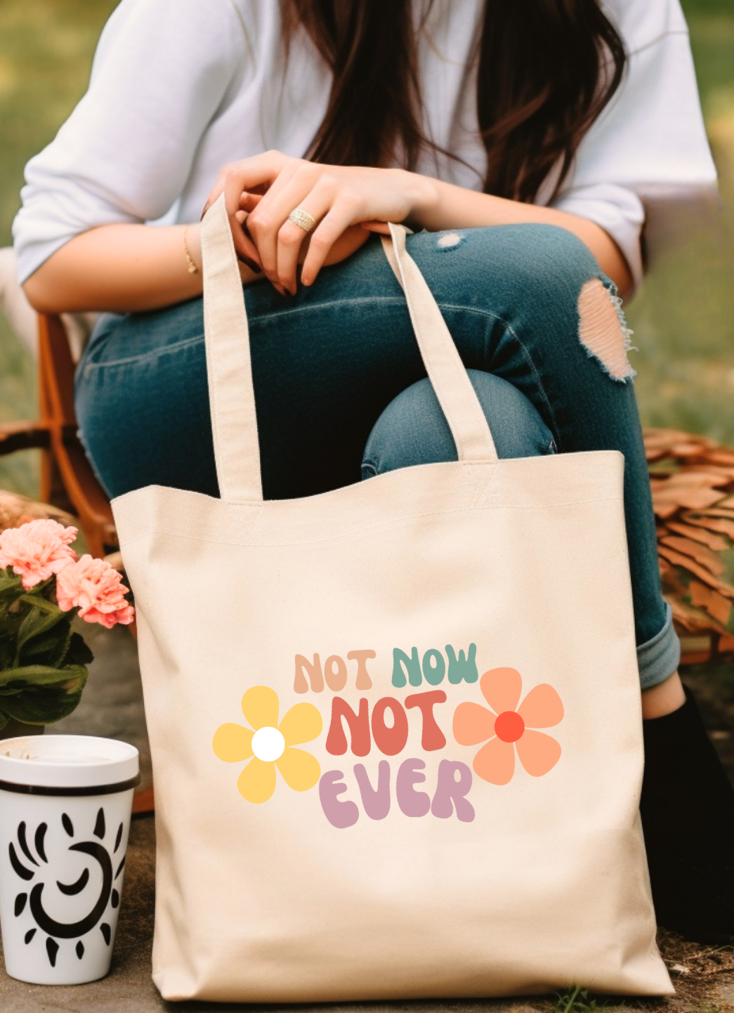 Elevate your everyday style with our high-quality cotton canvas tote bag, featuring a stunning retro floral design and the sassy, smart phrase: "Not Not, Not Ever." This chic and durable tote is perfect for carrying all your essentials while adding a touch of vintage charm and bold attitude. Whether you're heading to the market, beach, or just out and about, this bag combines practicality with personality. Don't miss out on this unique blend of flair and functionalityâ€”grab yours today and let your tote ma